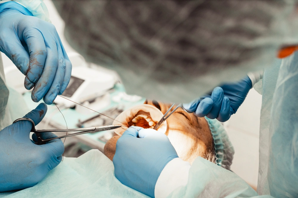 Patient receiving dental implant surgery.