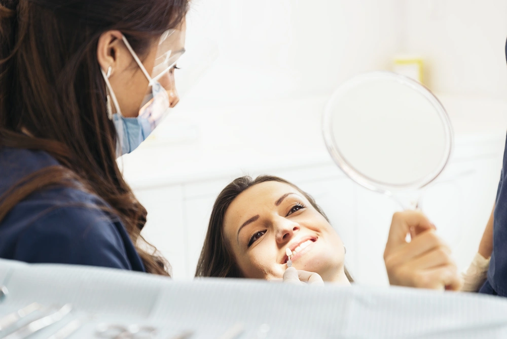 Dentist with a patient during a dental intervention.