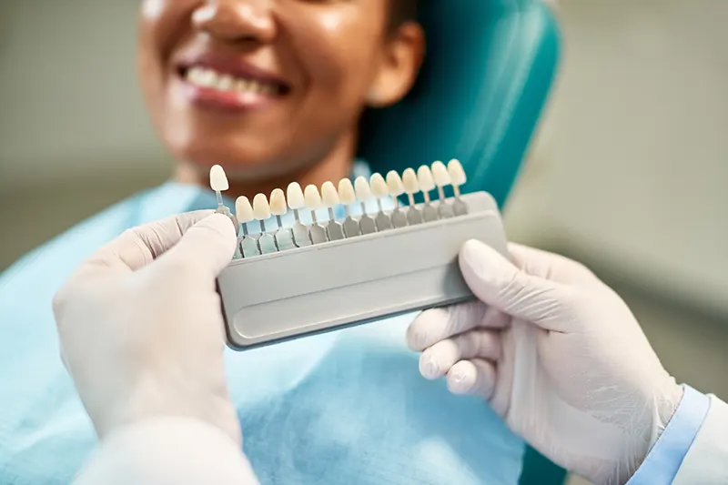 Smiling woman with new dental veneers
